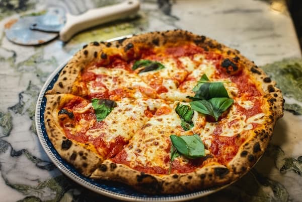 Customizable homemade pizza with fresh toppings and handcrafted dough showing personalized pizza making techniques